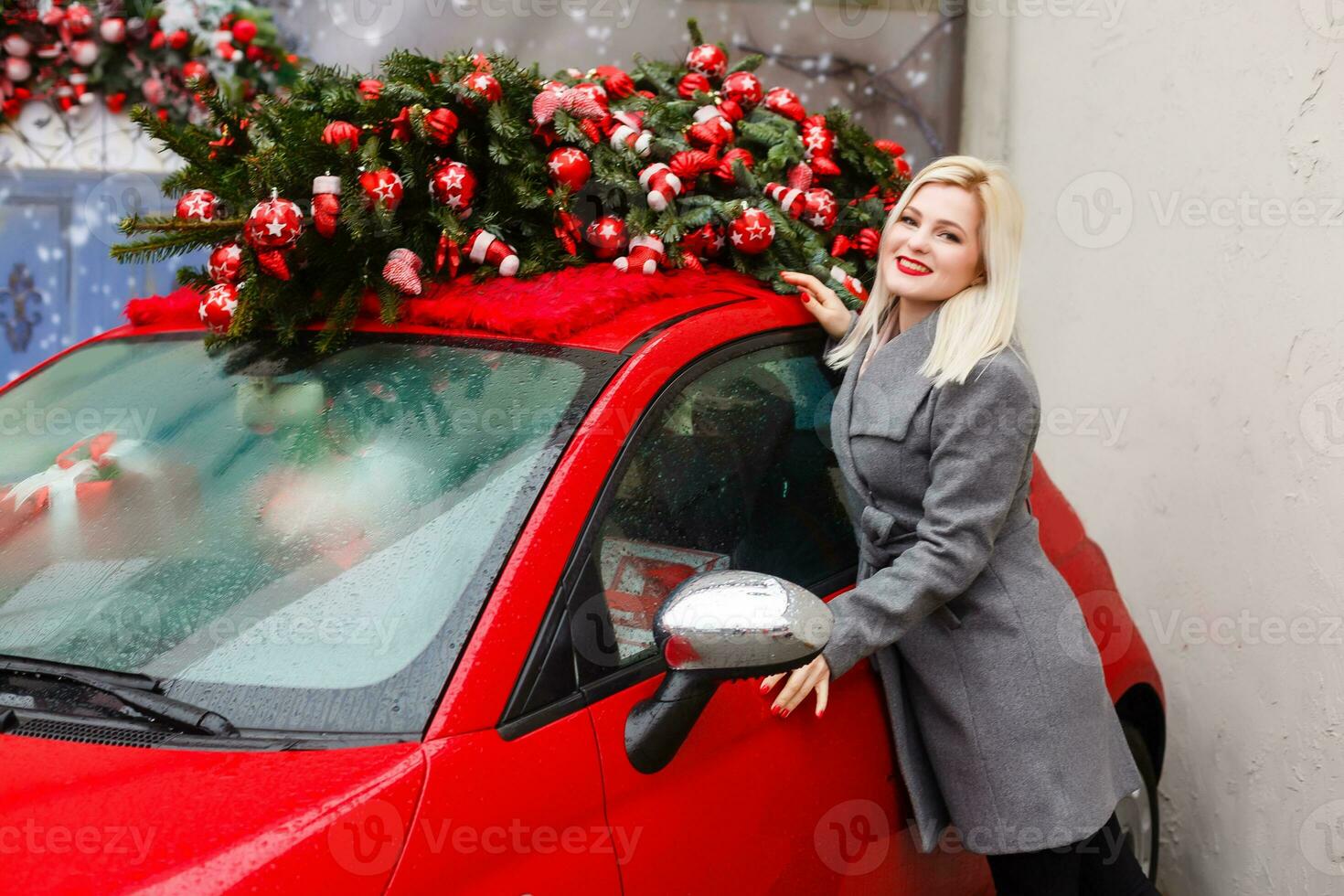 Happy young woman with a new car, christmas present photo