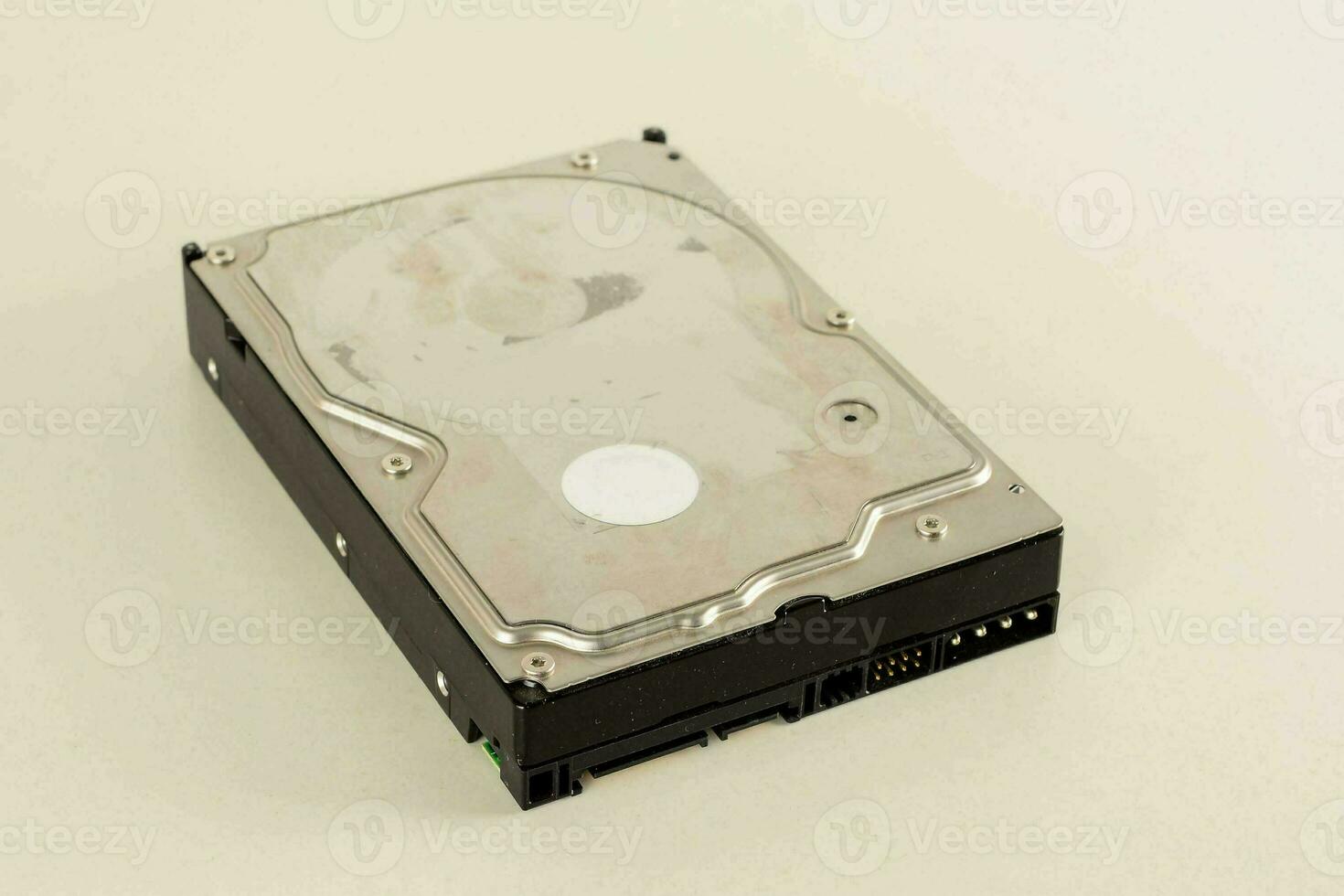 a hard drive sitting on a white surface photo