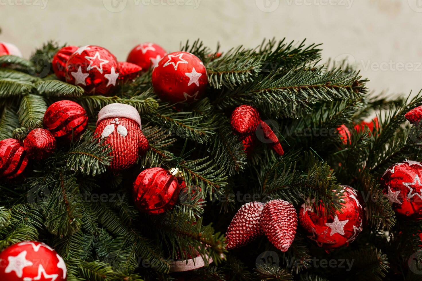Christmas background with decorative star, fir branches and pine cones photo