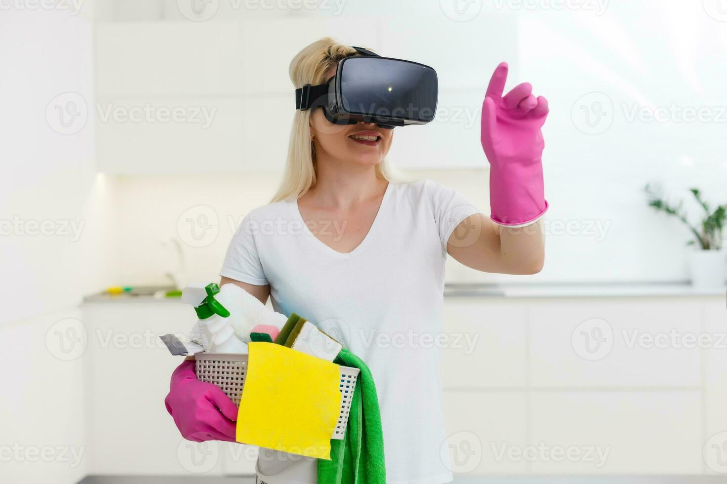 beautiful pretty housewife wearing VR device on living room looking 3D video using hand touching simulation to view house design. photo