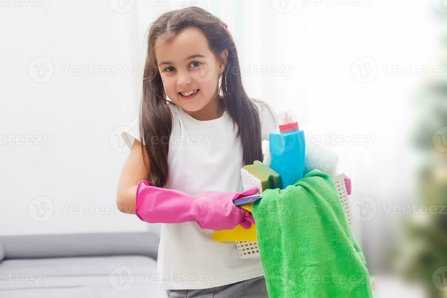 Little housekeeping fairy girl doing home chores photo