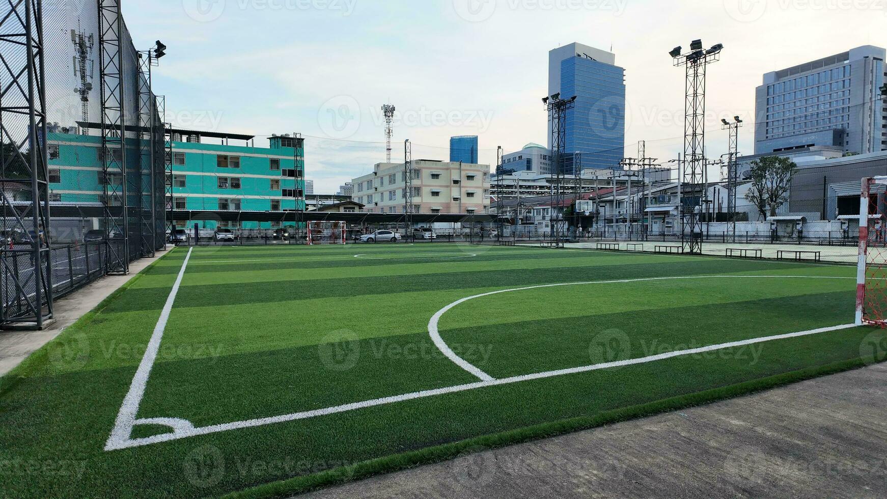 sport football soccer green court field game stadium grass background goal team competition play arena championship ball match playground building league night activity tournament player event sky photo