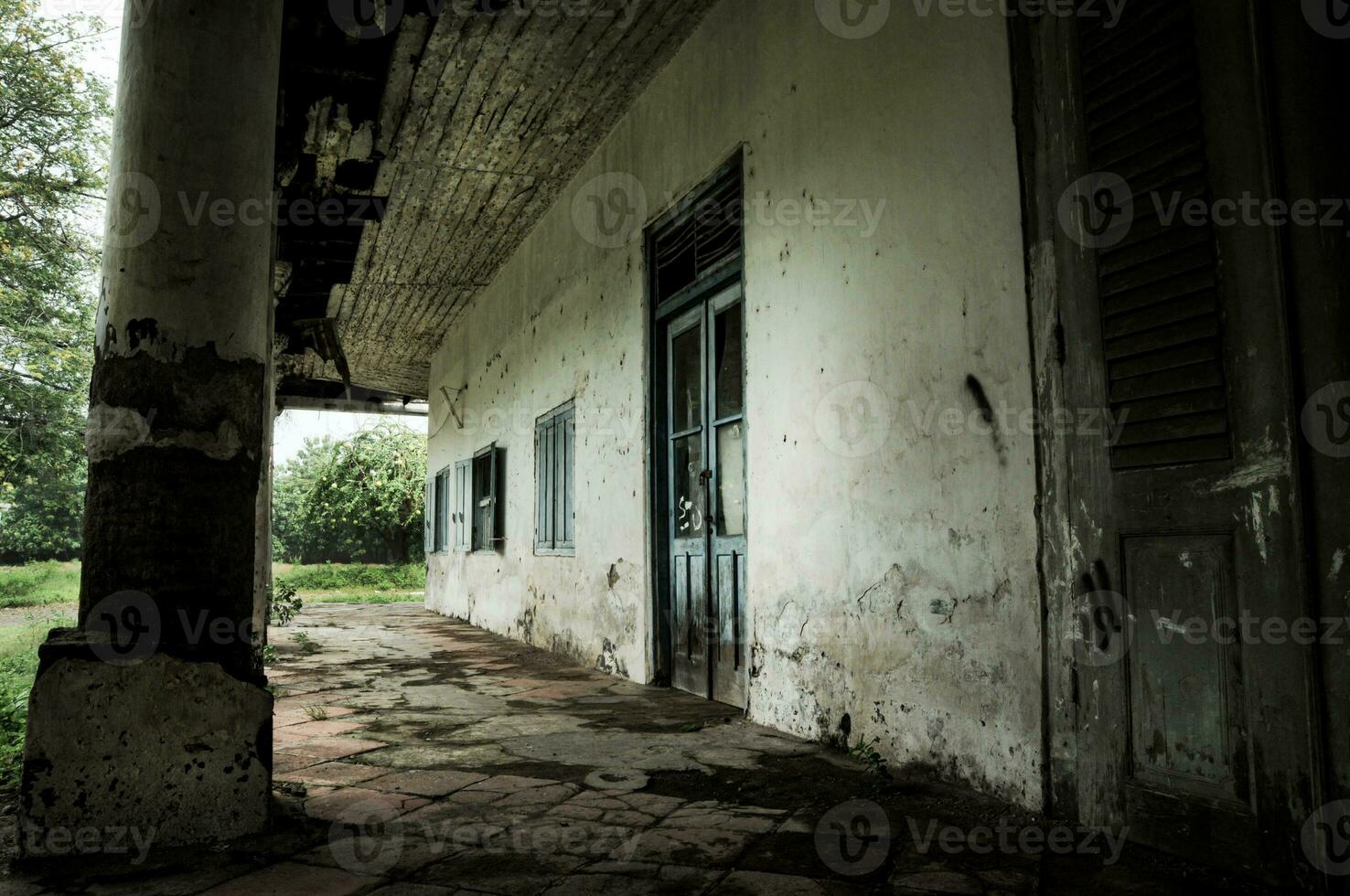 terrace of an empty house that has been left in a state of disrepair photo