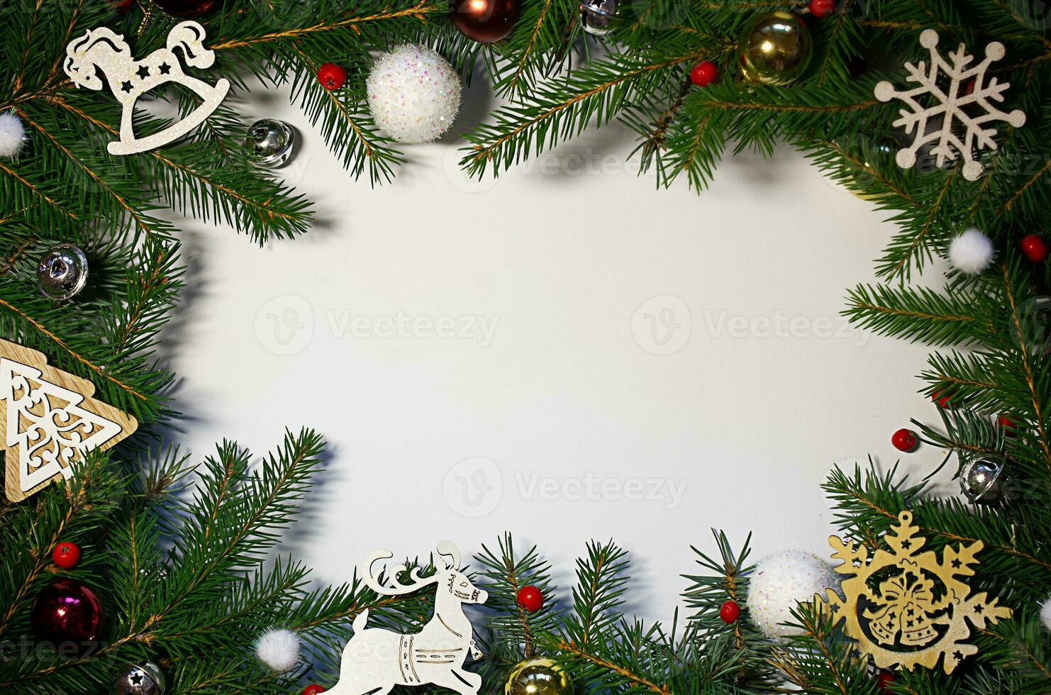 Creative composition with green spruce branches on a white background. Christmas background in retro style. New Year and Christmas holiday card. Nature New Year concept. photo