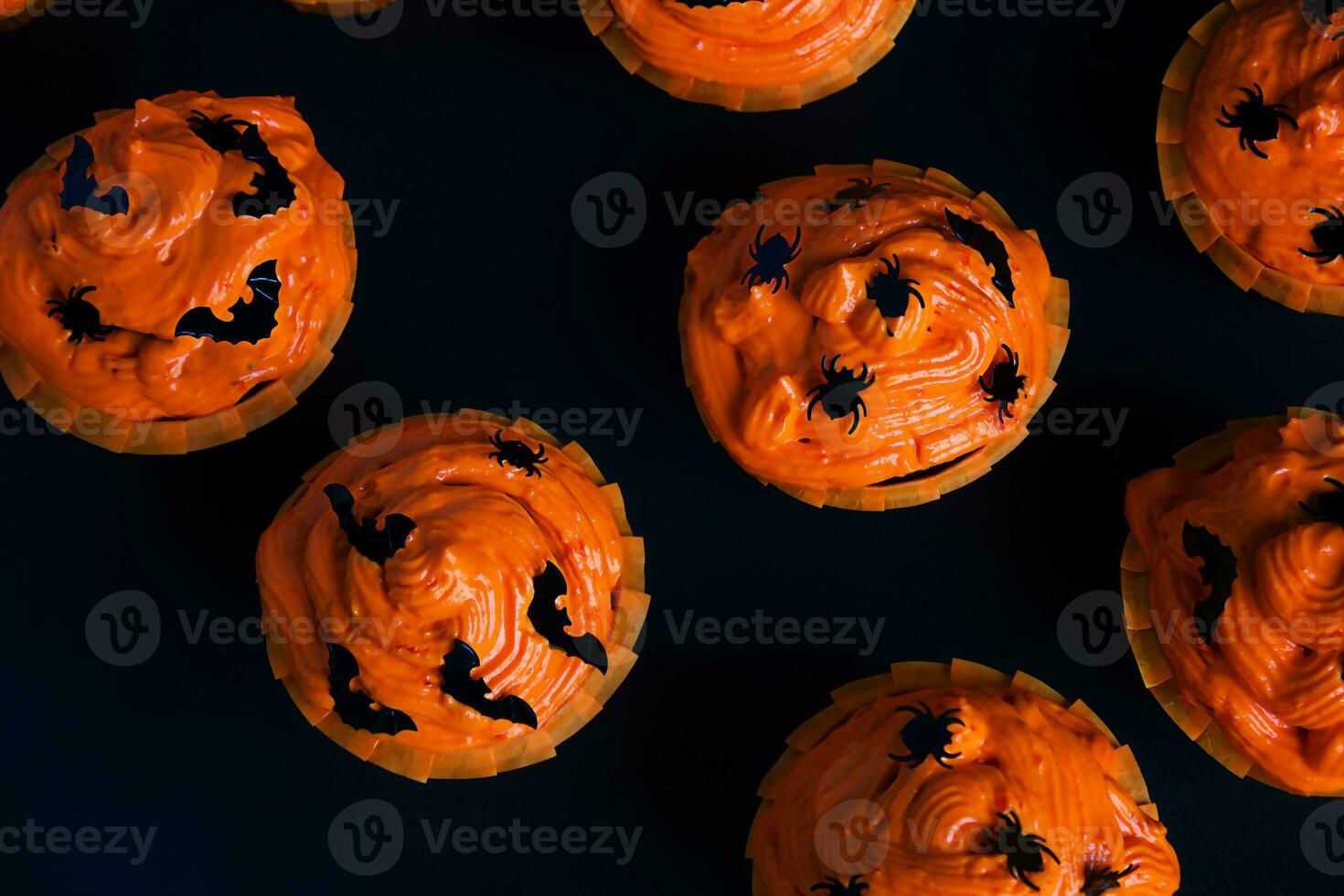 Cupcakes on a dark background.Sweets for Halloween celebration. photo