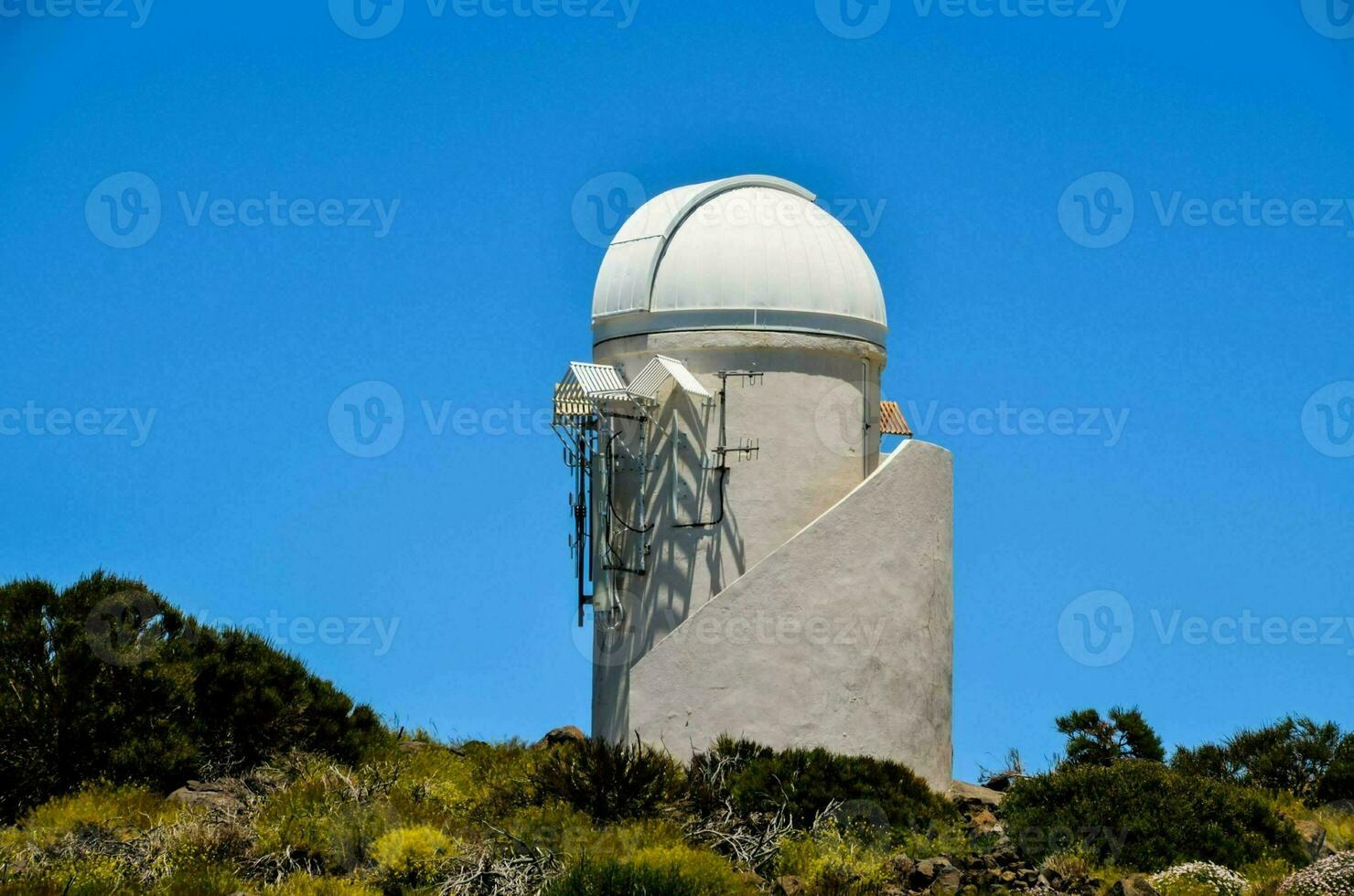 the observatory tower on top of a hill photo