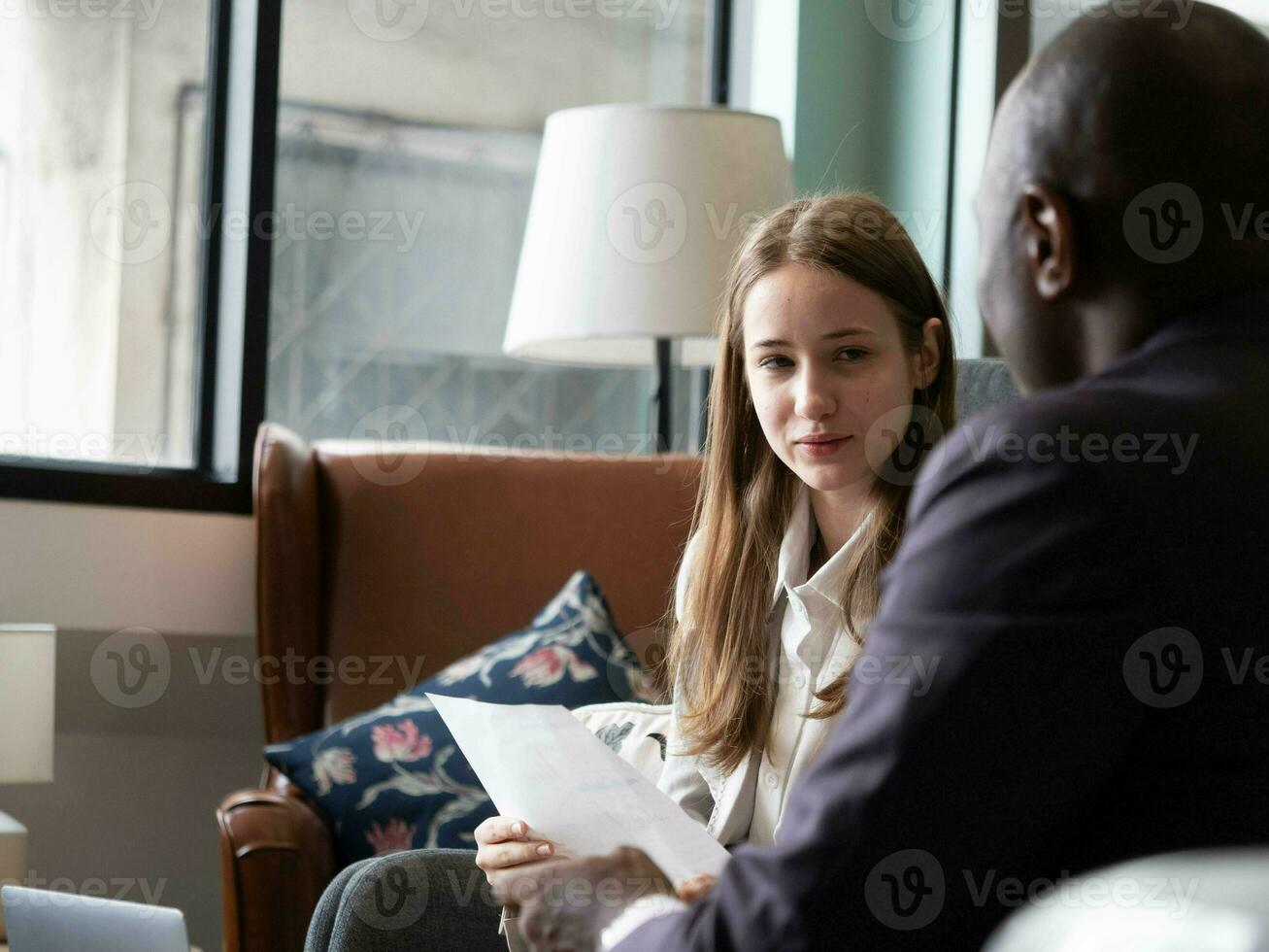 businesswoman female lady girl student teacher purpil person sit talk speak discussion explain business teach study learning sofa copy space room office south africa professional planning modern work photo