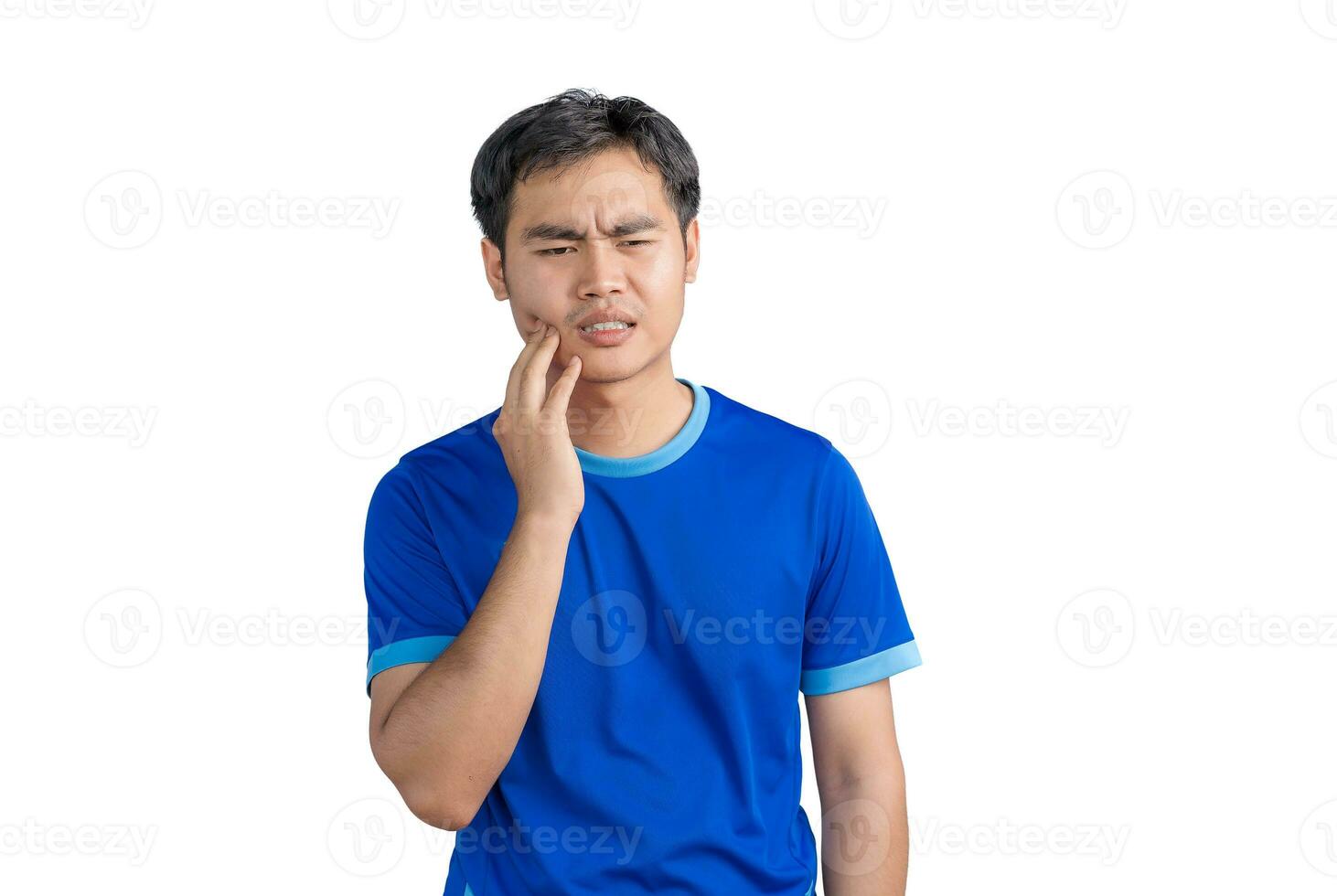 Young Asian man touching mouth suffering from toothache or dental illness on teeth isolated on white background. Male feeling pain, holding his cheek with hand, suffering from bad toothache. Dentist photo