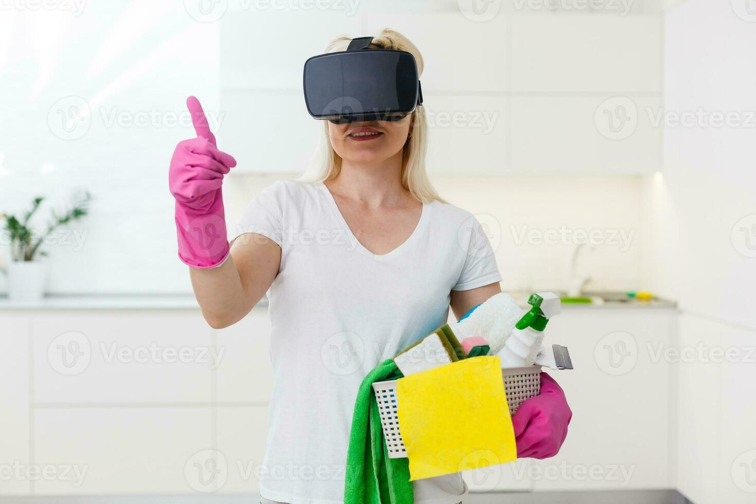 beautiful pretty housewife wearing VR device on living room looking 3D video using hand touching simulation to view house design. photo
