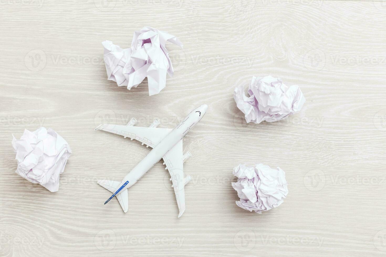 Airplane model flying among paper clouds, Traveling concept photo