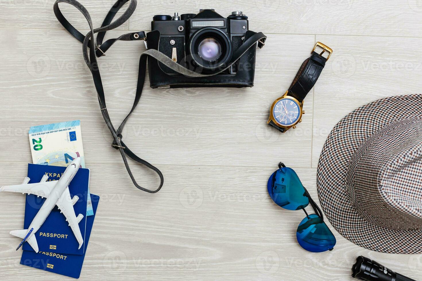 Travel and vacation concept. Trip accessories and items. Airplane toy over passport with airplane tickets. Top view flat lay with copy space photo