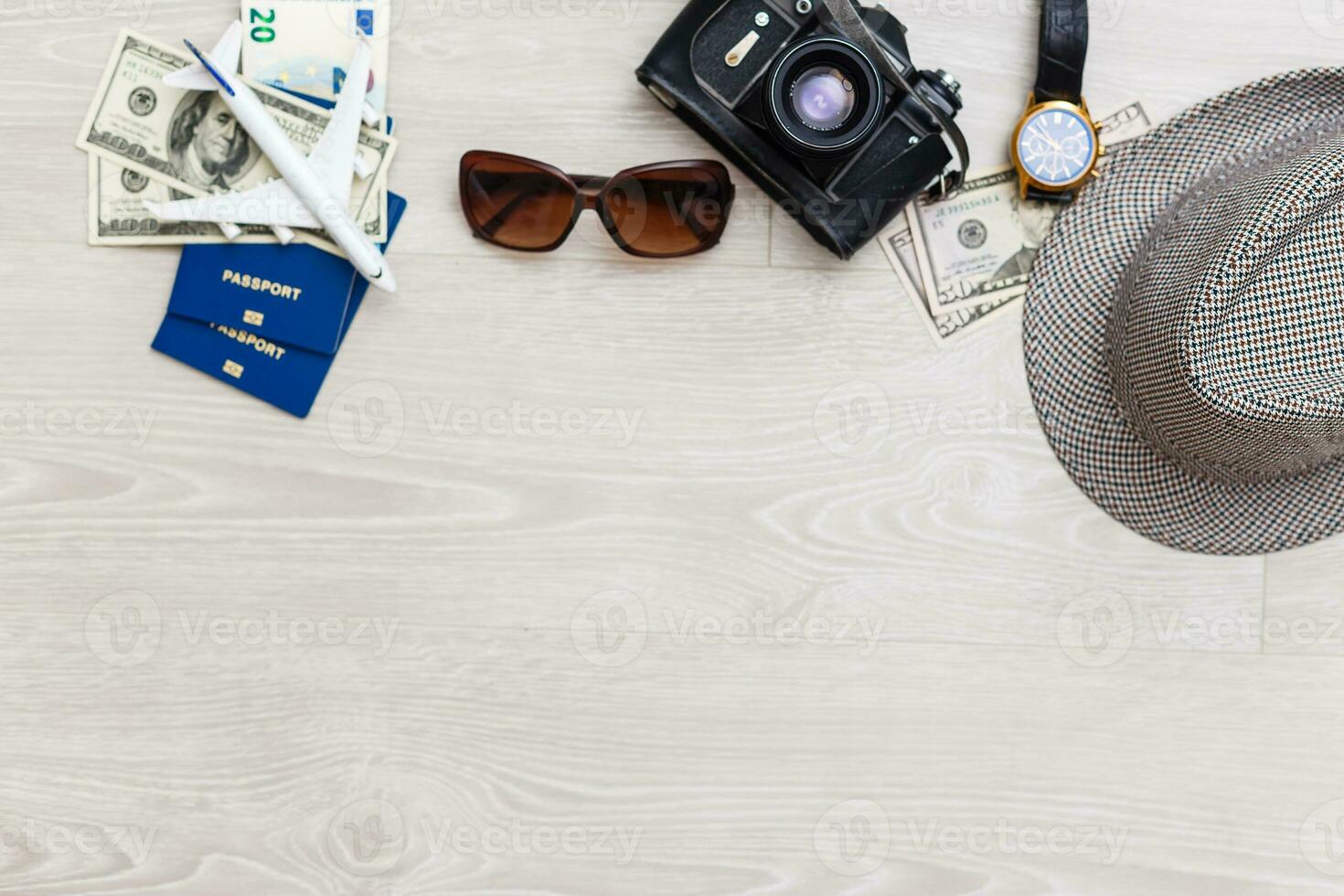 Travel and vacation concept. Trip accessories and items. Airplane toy over passport with airplane tickets. Top view flat lay with copy space photo