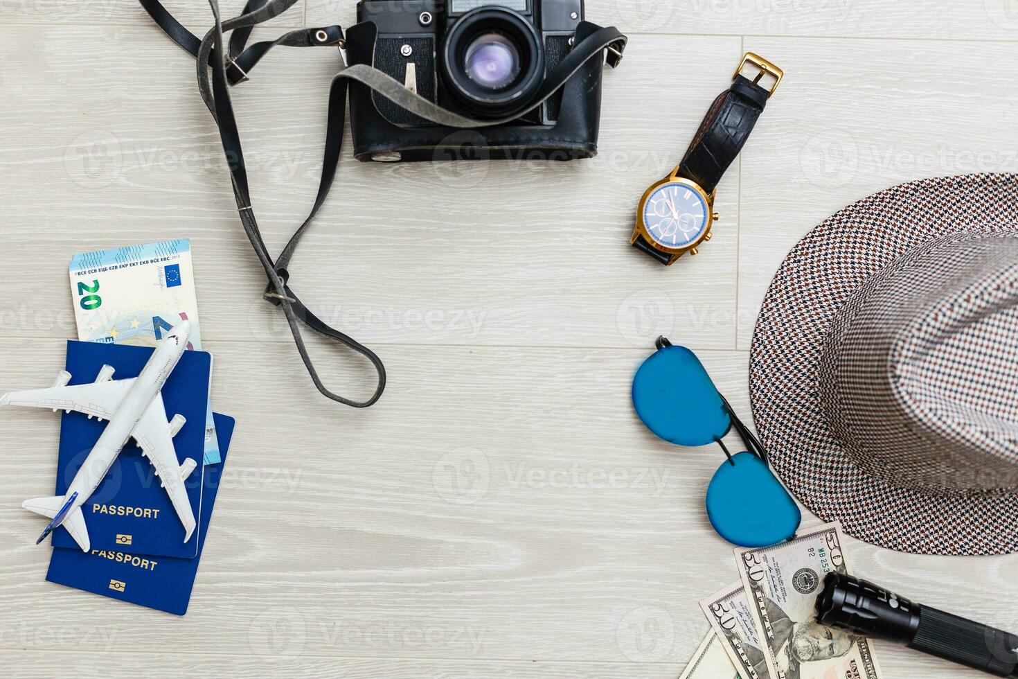Travel and vacation concept. Trip accessories and items. Airplane toy over passport with airplane tickets. Top view flat lay with copy space photo