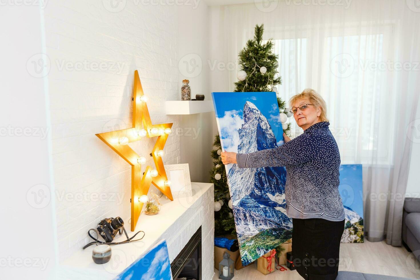 photo canvas. Blonde elderly woman feeling motivated while taking photo canvas