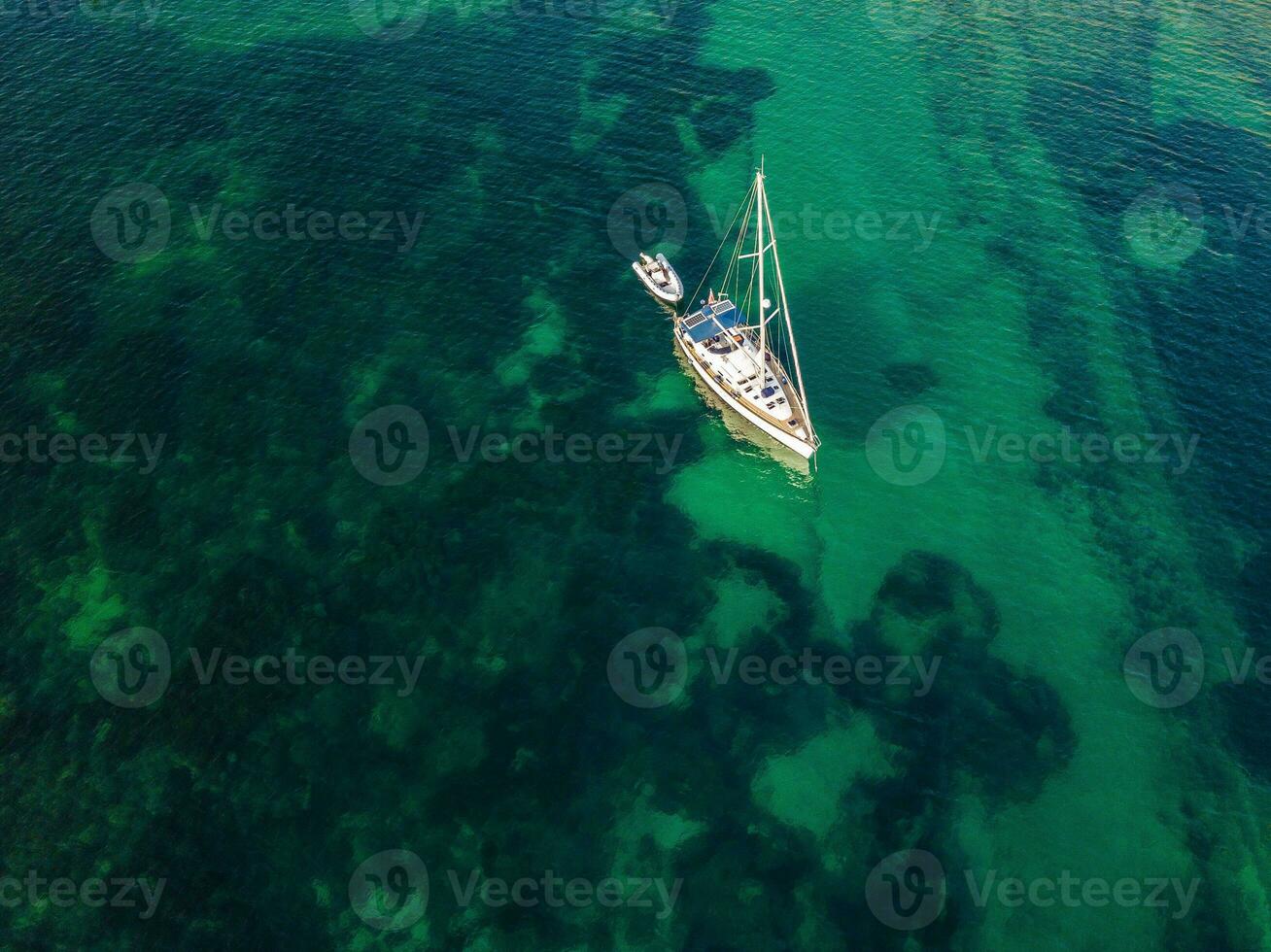 High view on the lone yacht in the sea photo