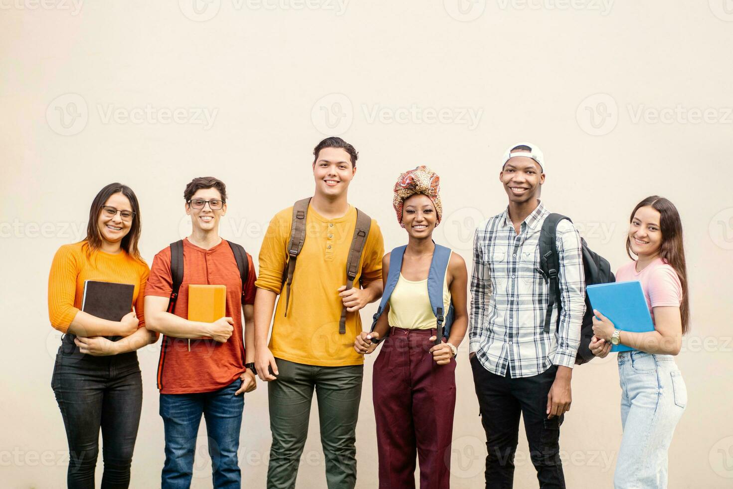 Group of young university students with backpack. photo