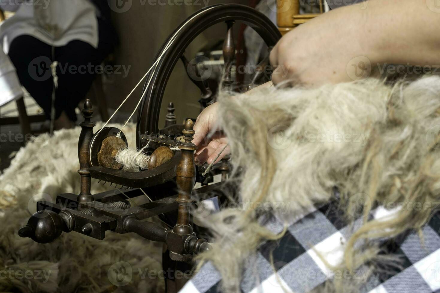 Woman weaving with a weaver photo