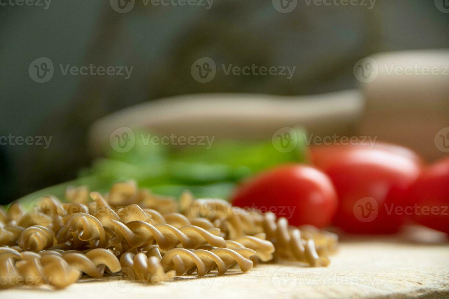 Uncooked gluten free Teff fusili pasta photo