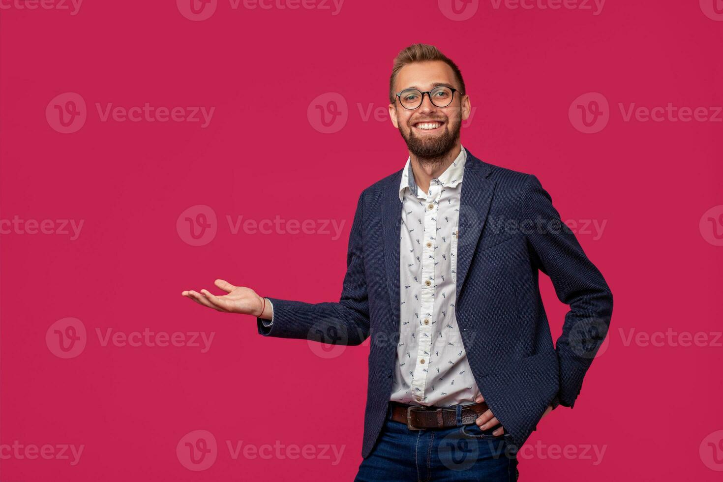 Studio shot of attractive brunette business man with glasses, in casual shirt, stylish black jacket, smiling. photo