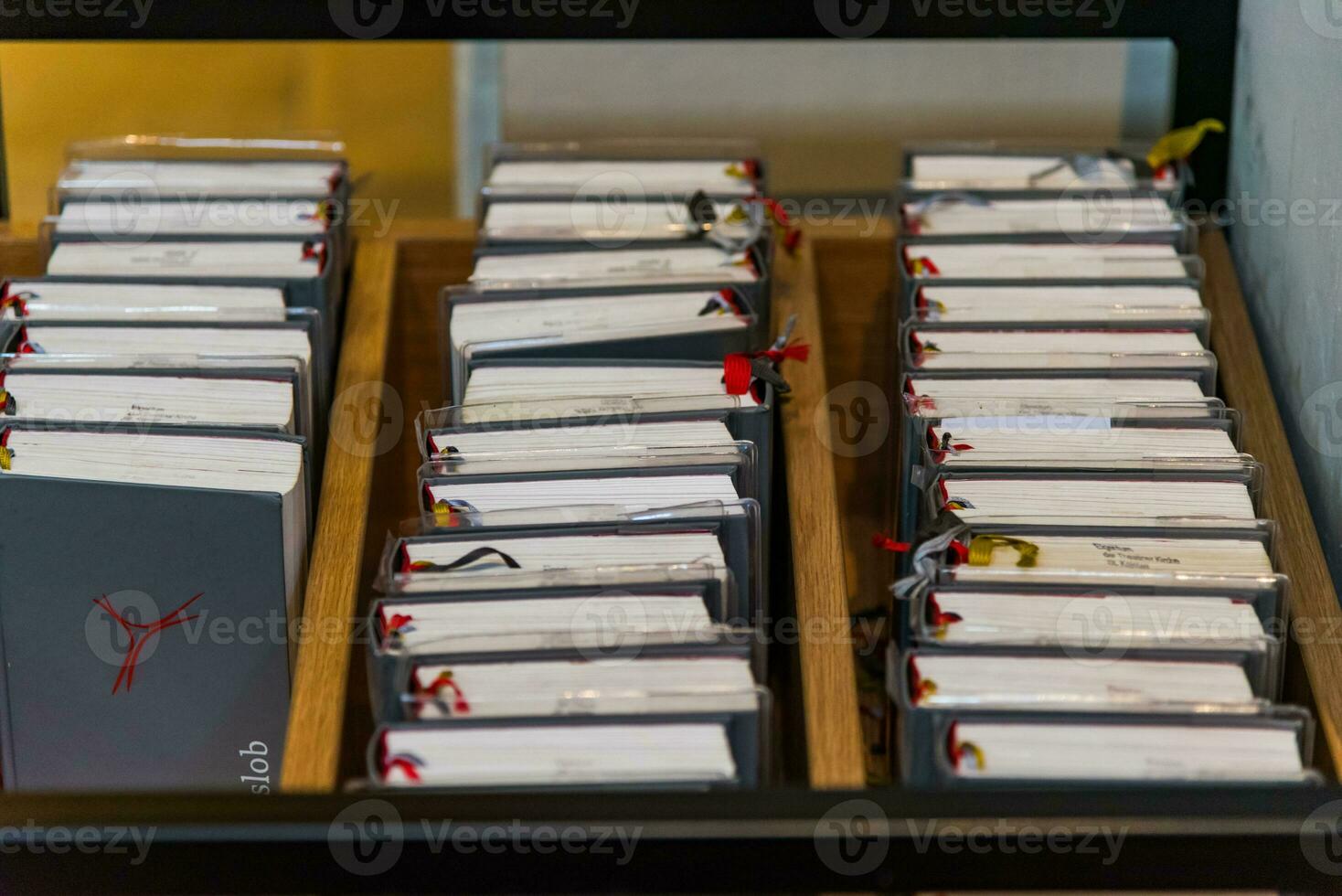 Close up shot of grey hymnbooks in German cathedral photo