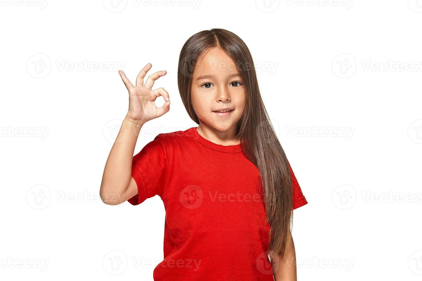 Girl showing positive sign on natural background photo