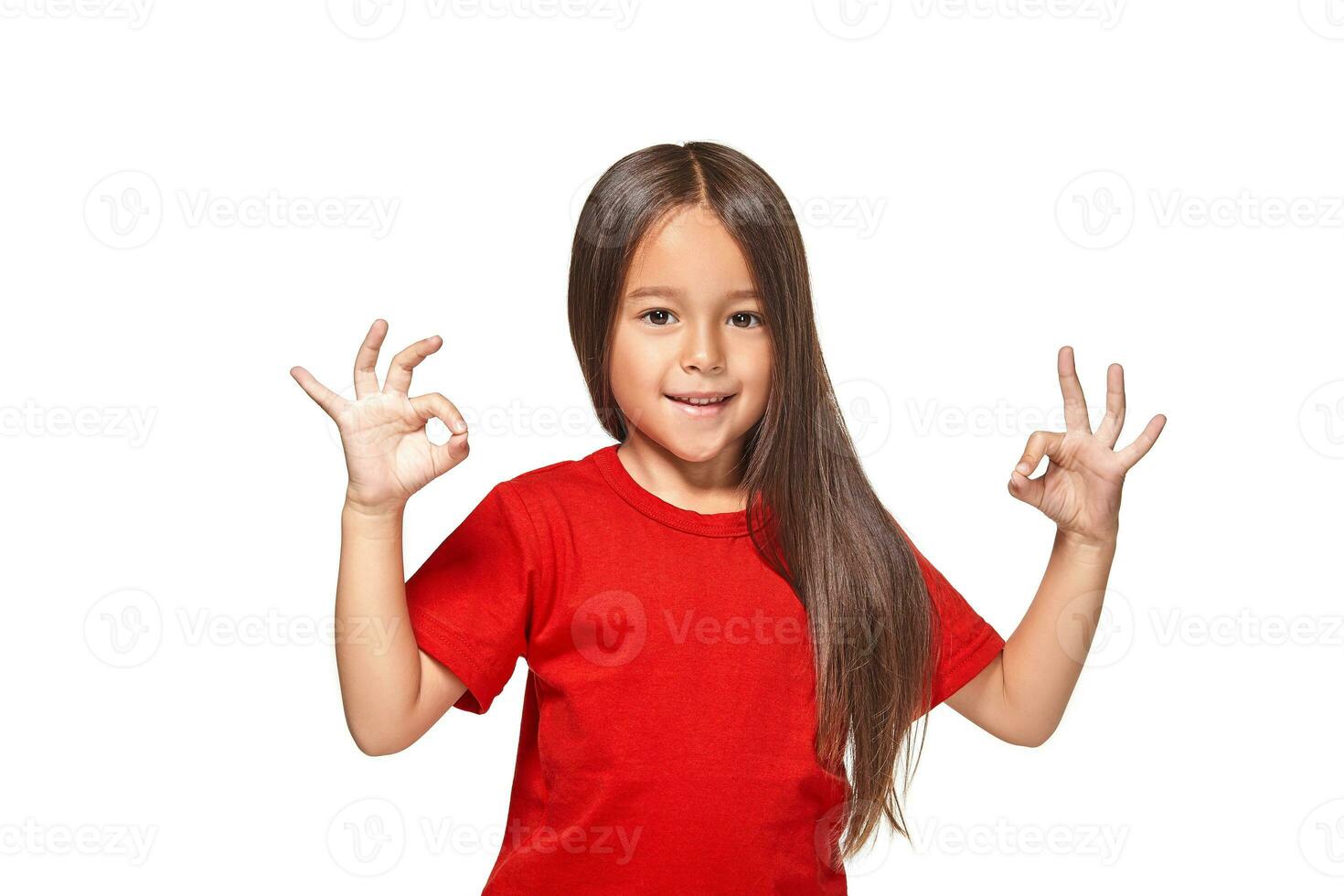 Girl showing positive sign on natural background photo