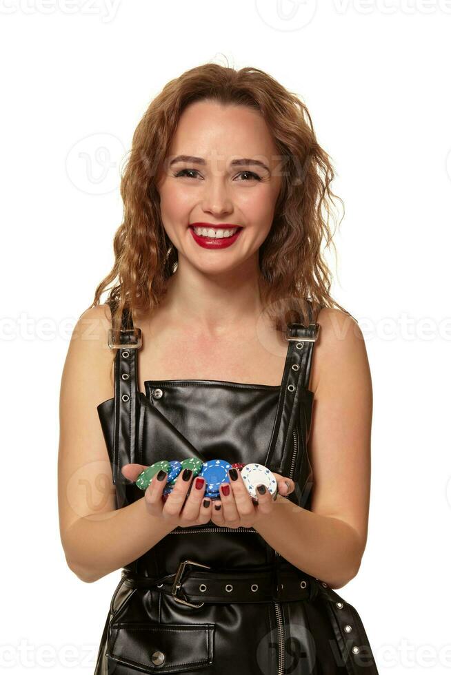 Casino concept. Portrait of young pretty caucasian woman, playing in casino. Roulette, poker chips, cards, wheel, isolated white background photo