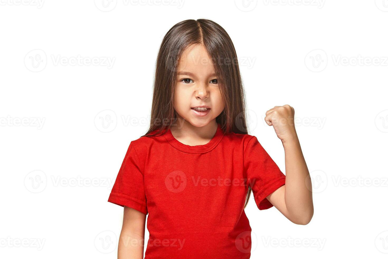 Beautiful girl in red t-shirt shakes her fist photo