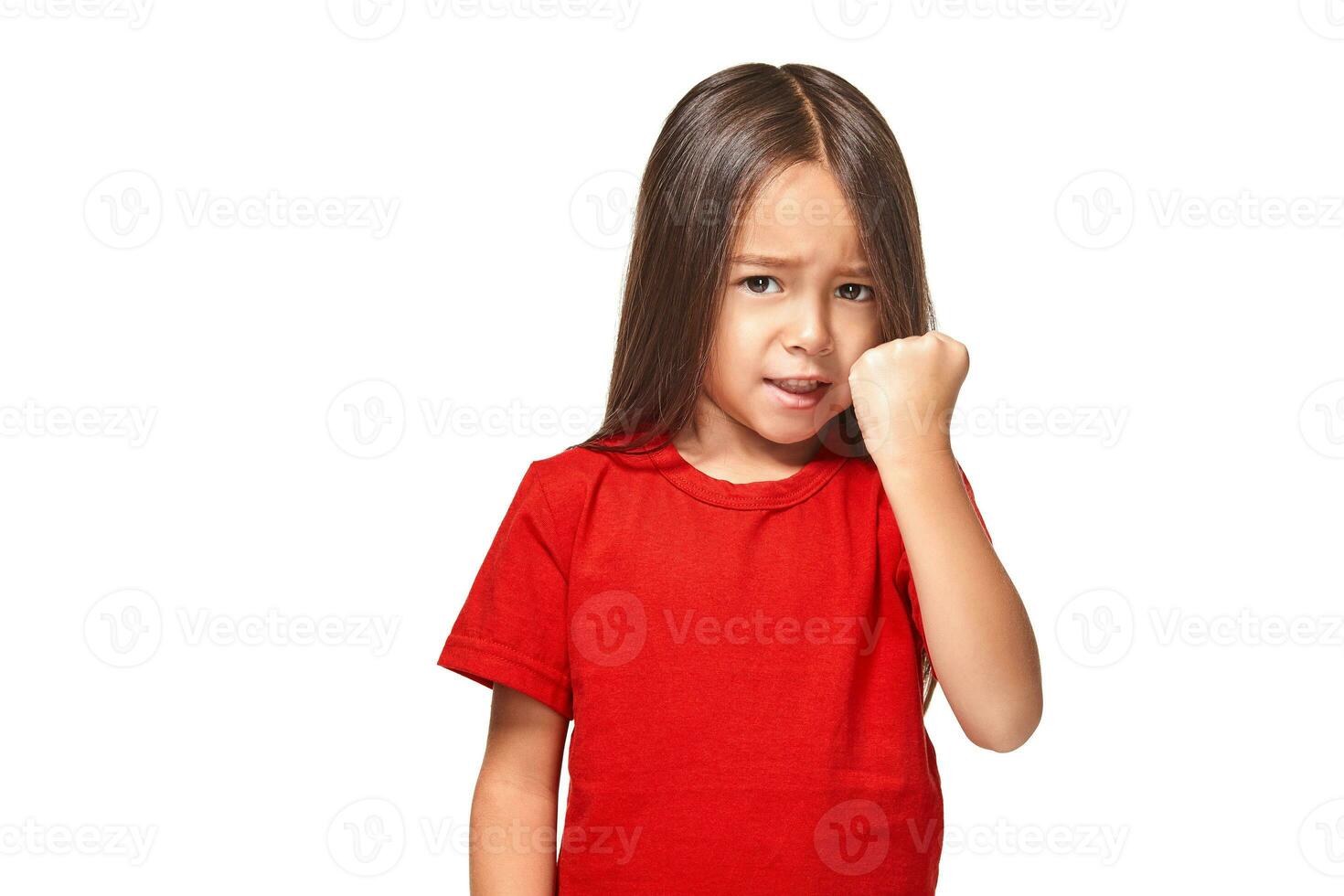 Beautiful girl in red t-shirt shakes her fist photo