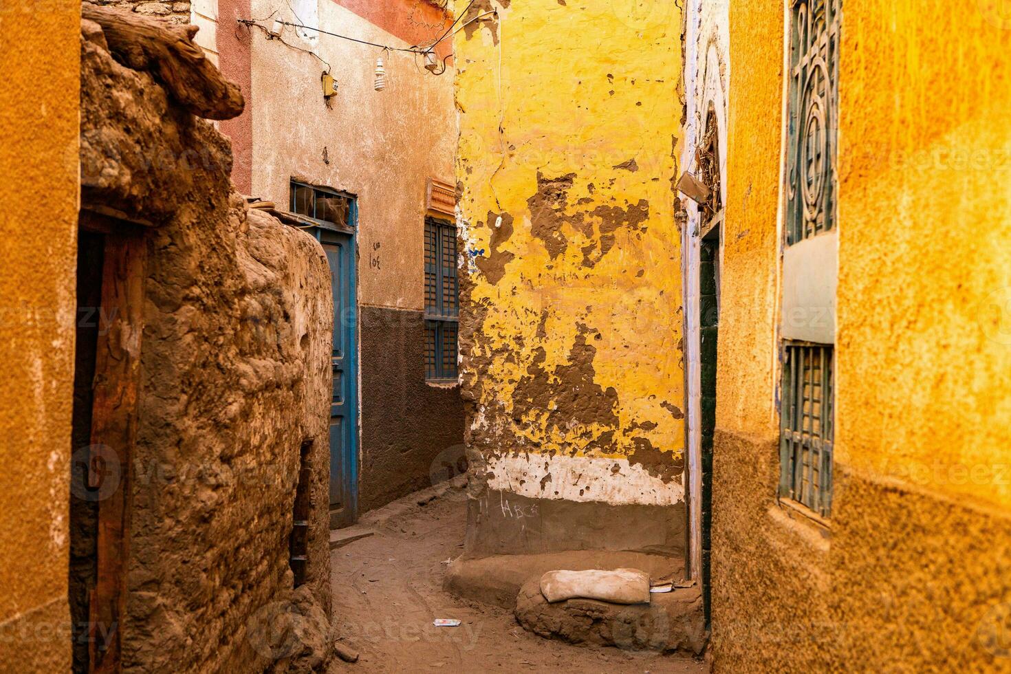 Colourful exterior wall of a Nubian house in Egypt. Typical African village houses facade. Medieval street. photo
