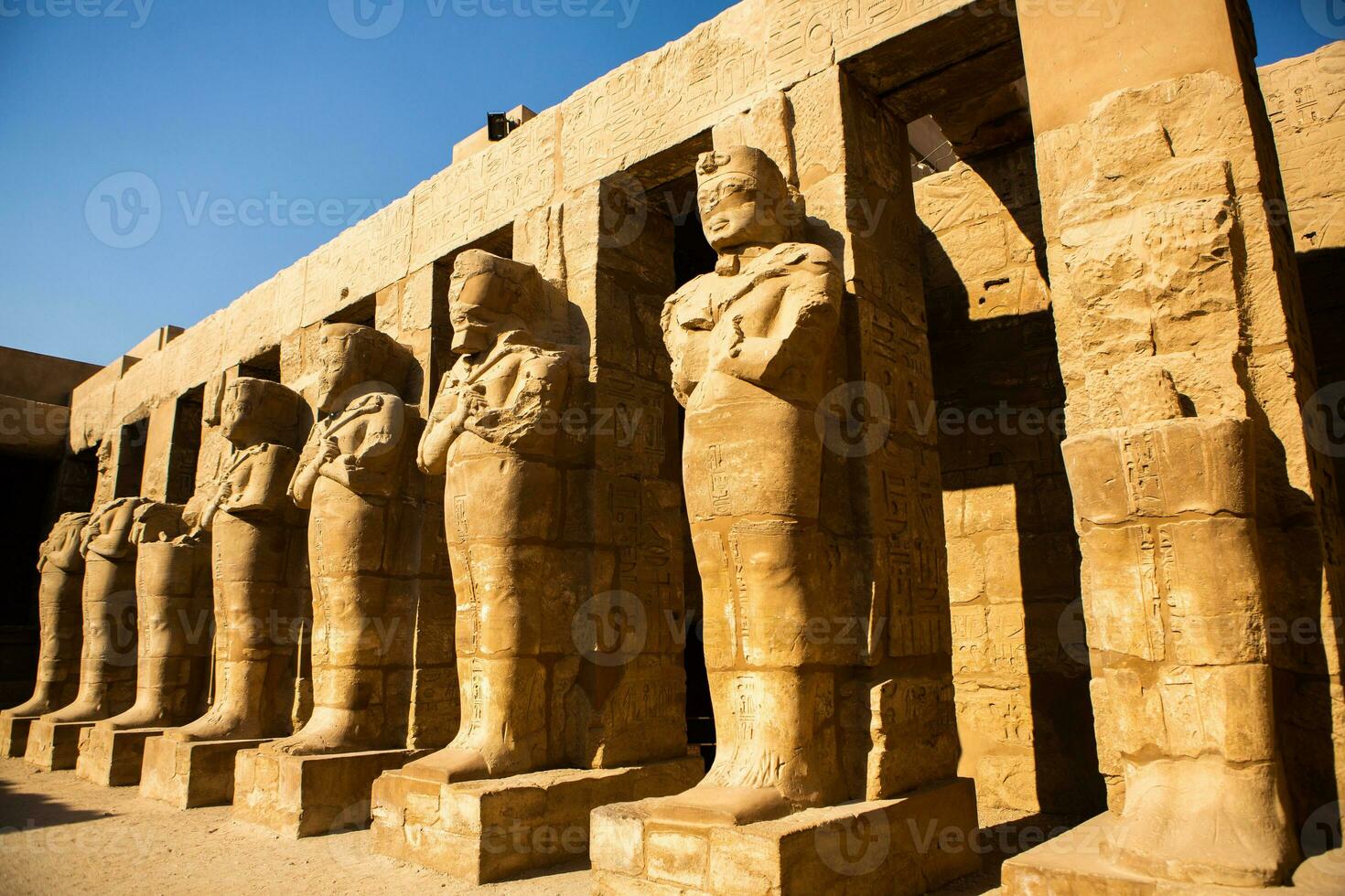 Dendera Temple complex in Egypt. Hieroglypic carvings on wall at the ancient egyptian temple. photo