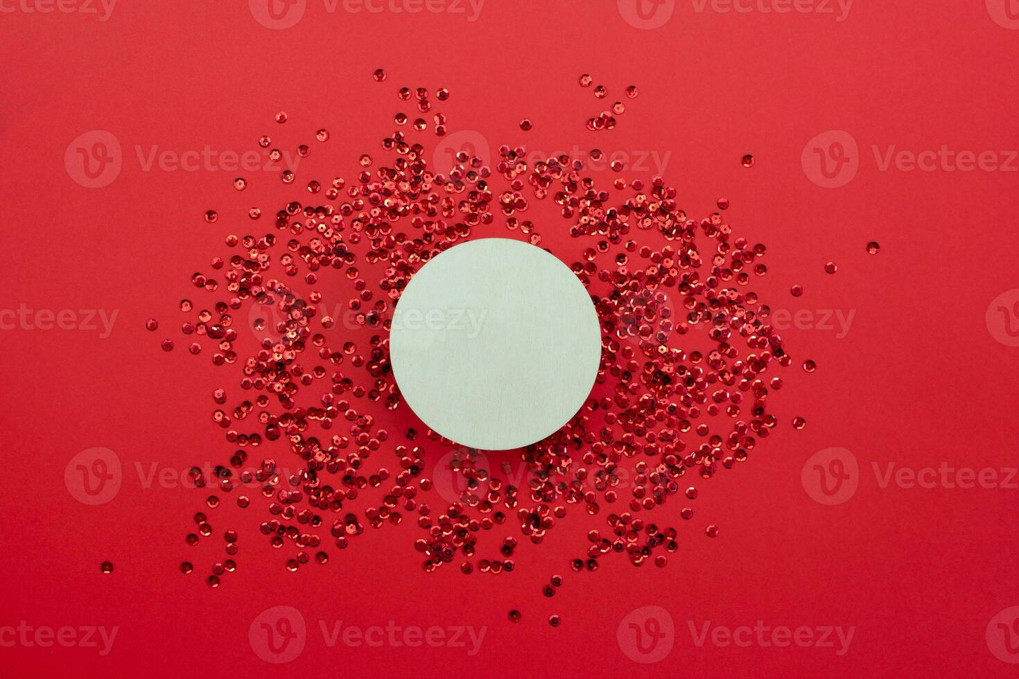 Wooden circle on red background. Copy space. photo