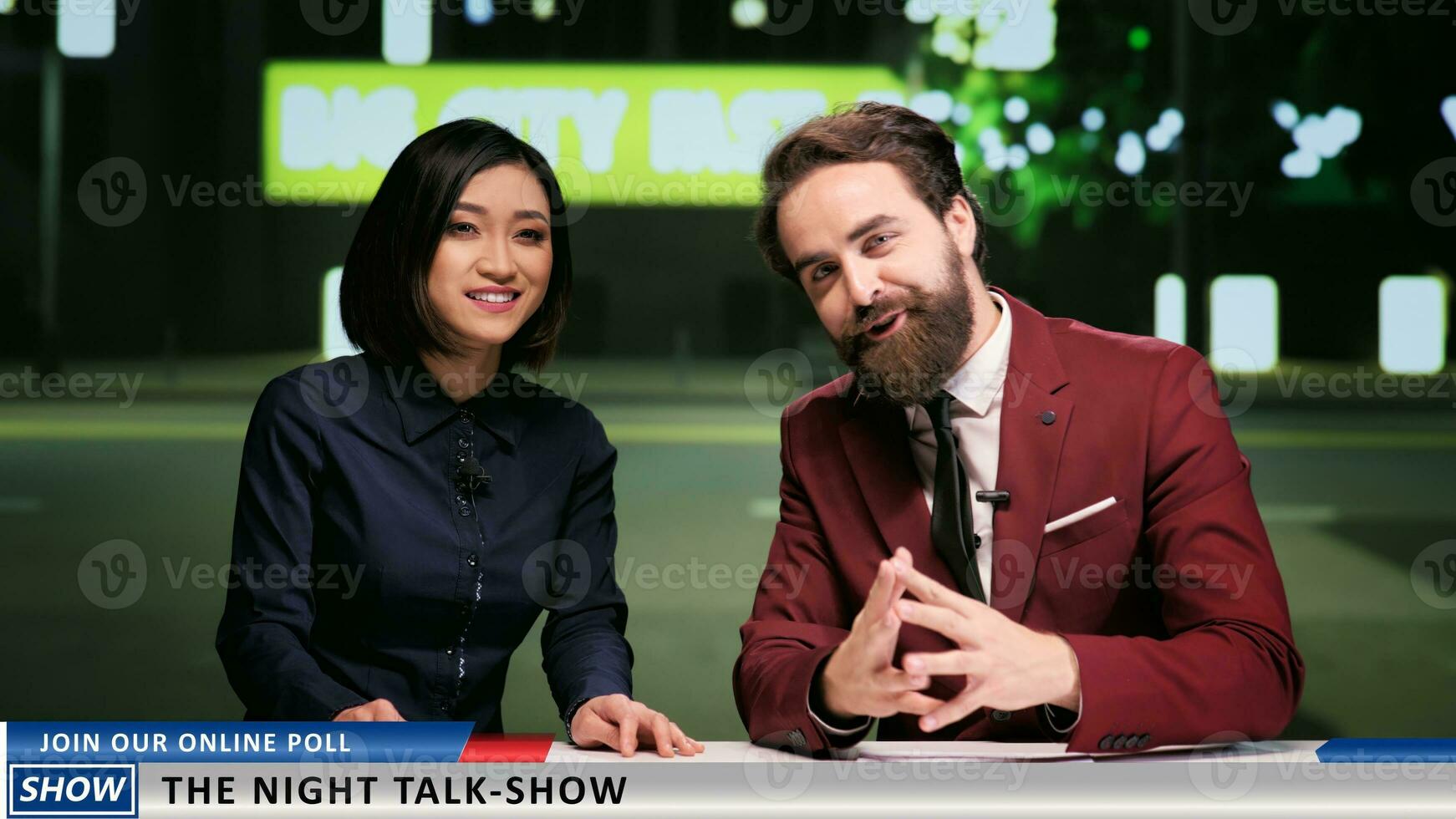 Newscasters team talk on tv program presenting events regarding famous people and working on new media segment. Late night talk show hosts addressing global interest topics live. photo