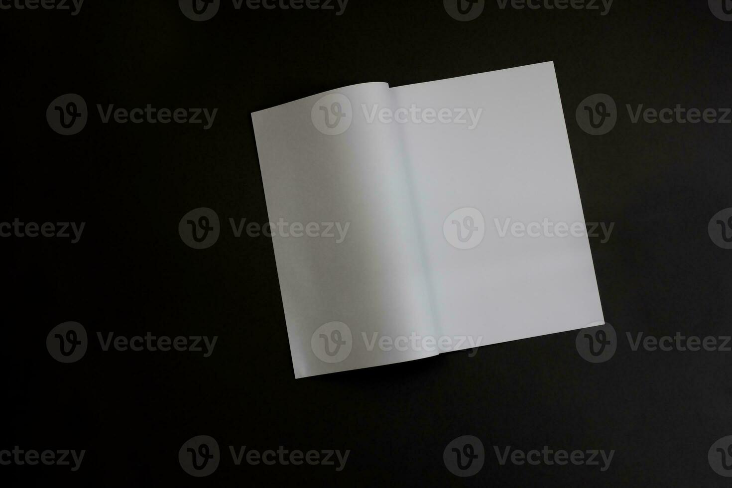 White magazine or catalog template on a black background. photo