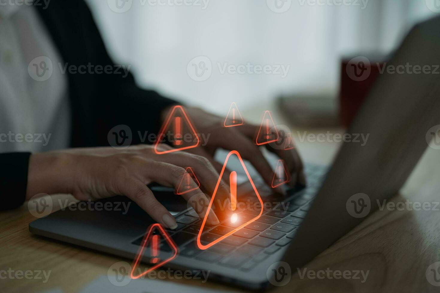 Businesswoman using laptop showing virtual screen icon caution warning triangle and exclamation sign icon Warning of dangerous problems Server error. Virus. Internet network security concept. photo