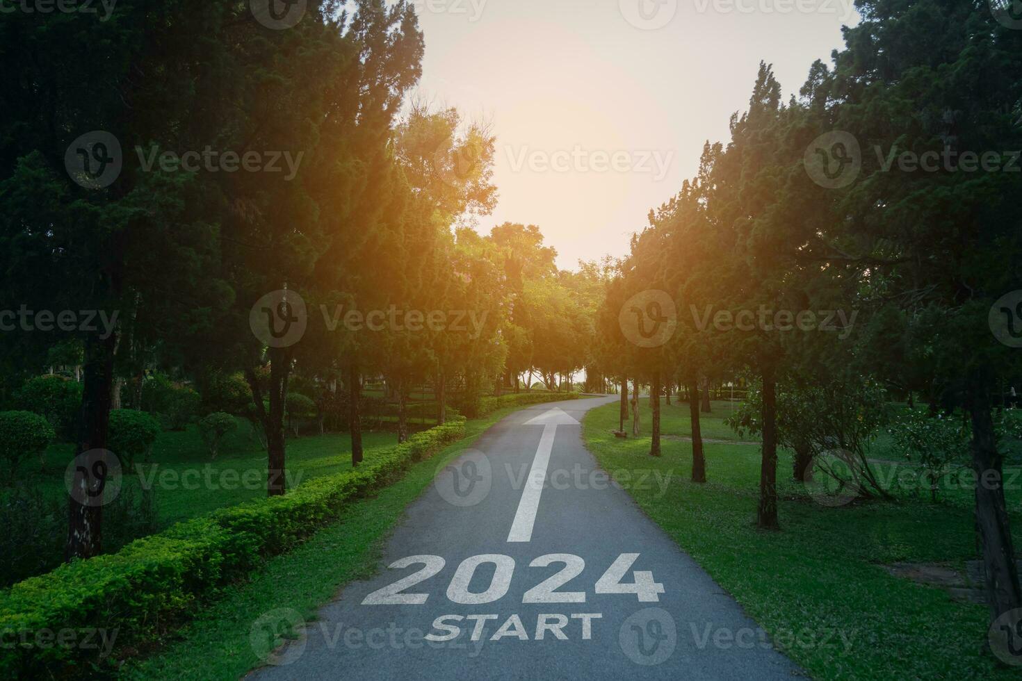 Happy new year 2024,2024 symbolizes the start of the new year. The letter start new year 2024 on the road in the nature route roadway have tree environment ecology or greenery wallpaper concept. photo
