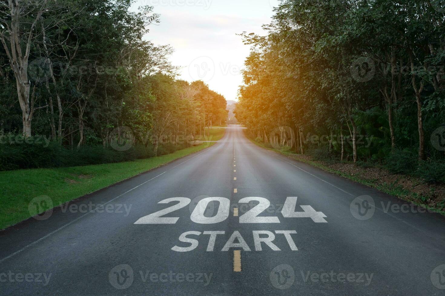 Happy new year 2024,2024 symbolizes the start of the new year. The letter start new year 2024 on the road in the nature route roadway have tree environment ecology or greenery wallpaper concept. photo