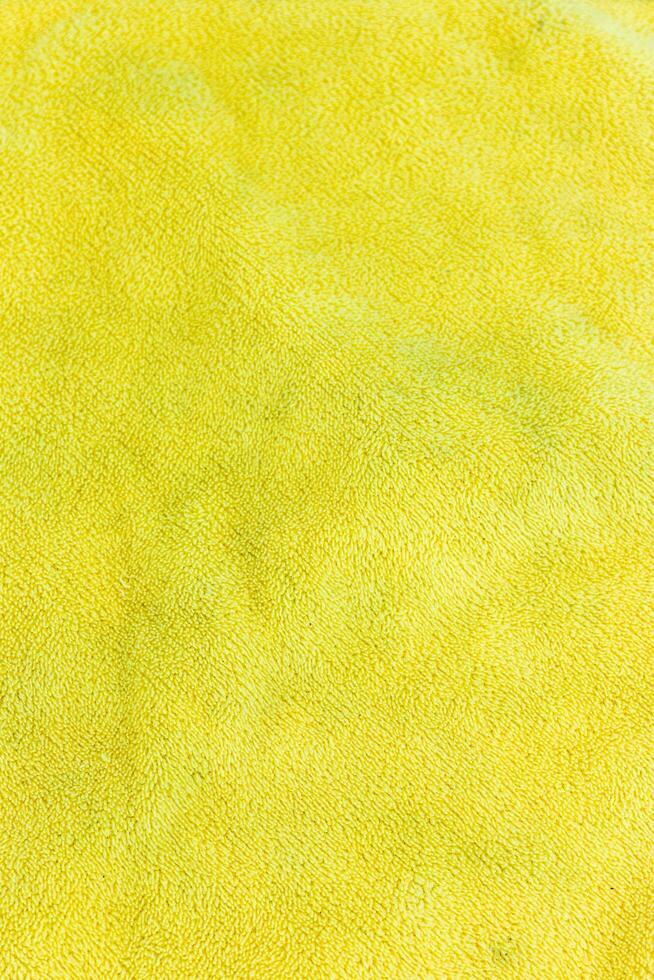 Close up of yellow fabric texture background. Close up of yellow fabric texture. photo