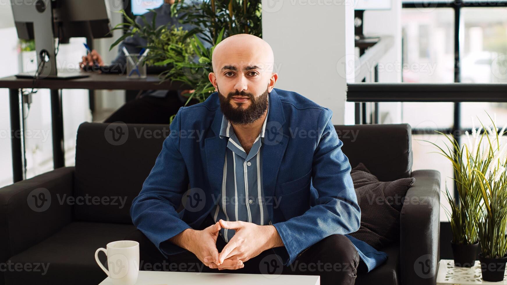 Manager using videocall connection in office space, discussing about data management with colleagues. Startup sales analyst on online conference meeting solving development issues. Tripod shot. photo