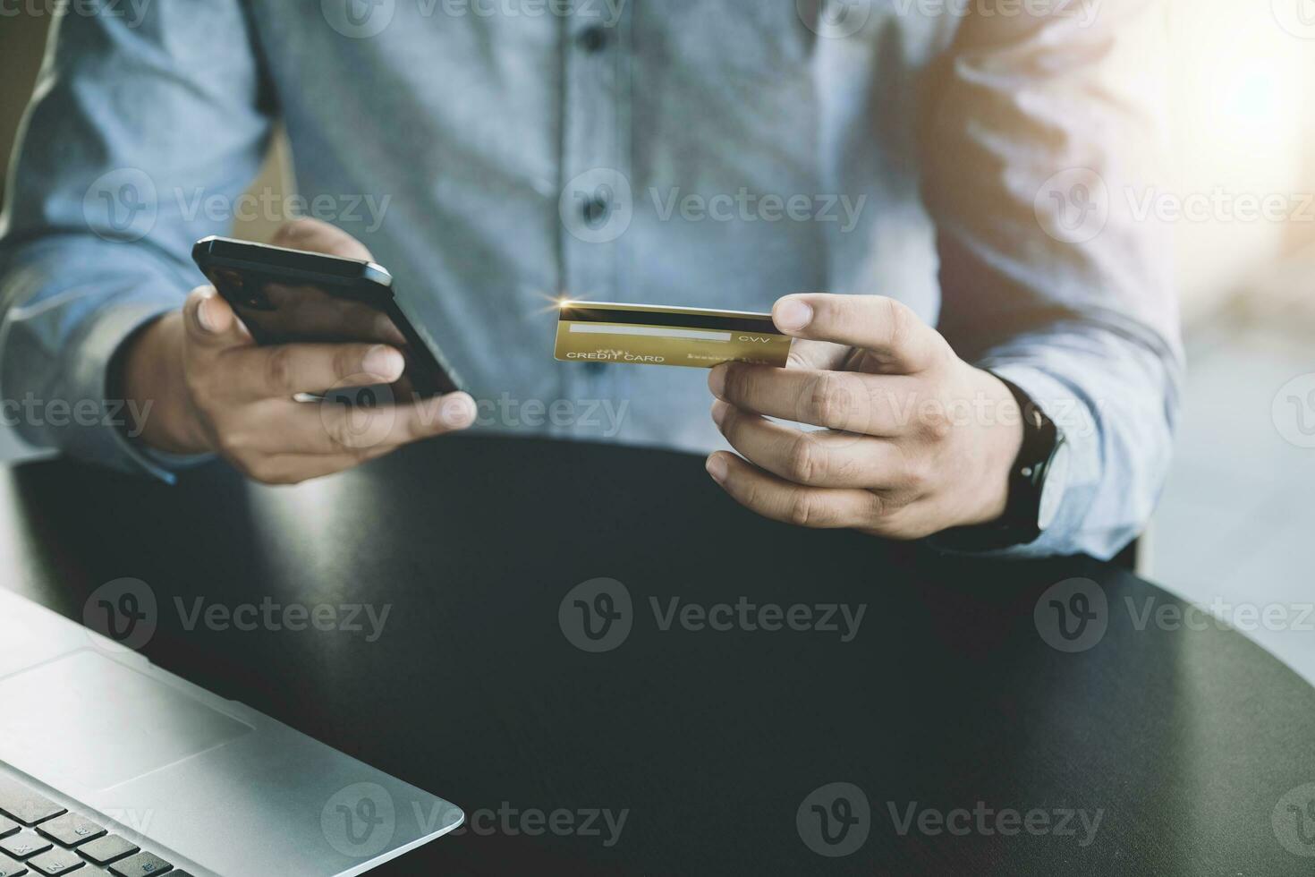 Online Shopping and Internet Payments, Asian man are using their credit card and mobile phone to shop online or conduct errands in the digital world. photo