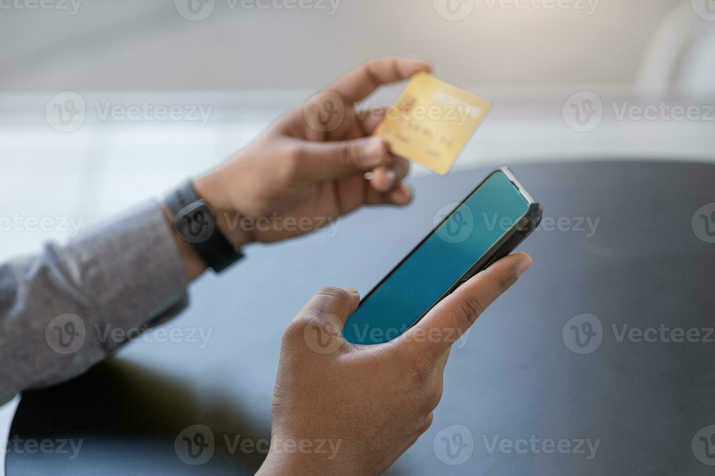 Online Shopping and Internet Payments,Asian man are using their mobile phones and credit cards to shop online or conduct errands in the digital world. photo