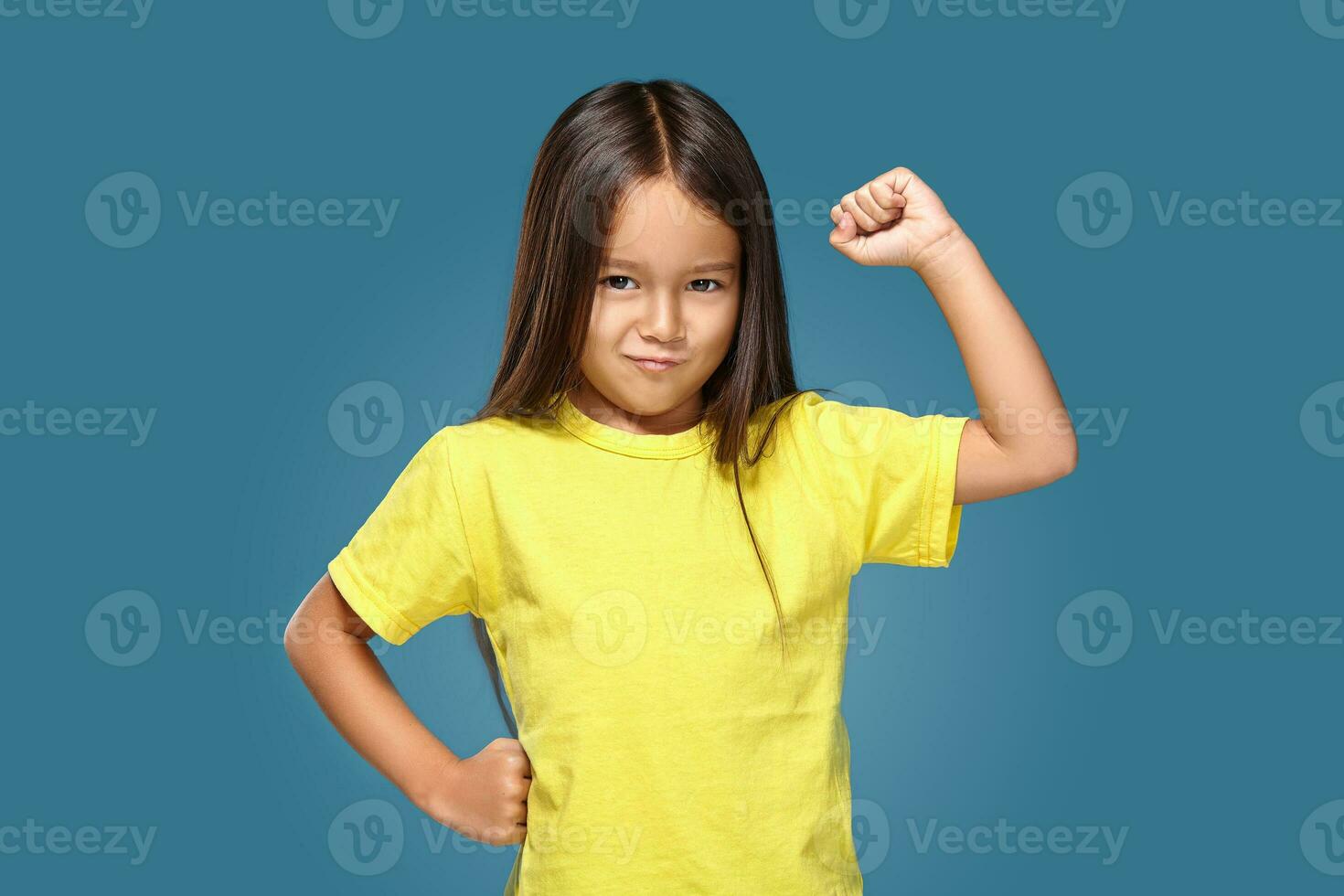 Angry little kid showing frustration and disagreement photo