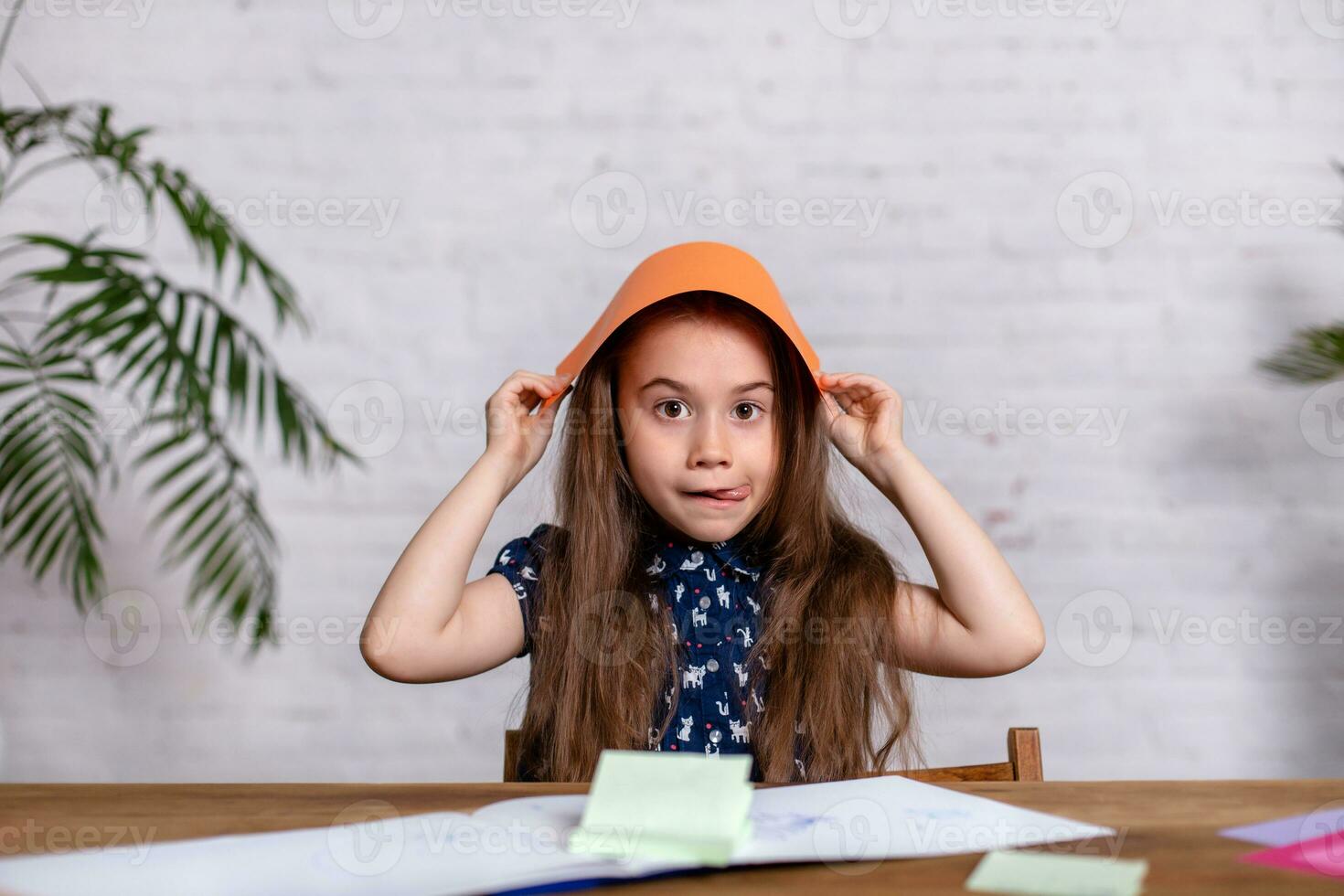 Cute little girl with the colored paper photo