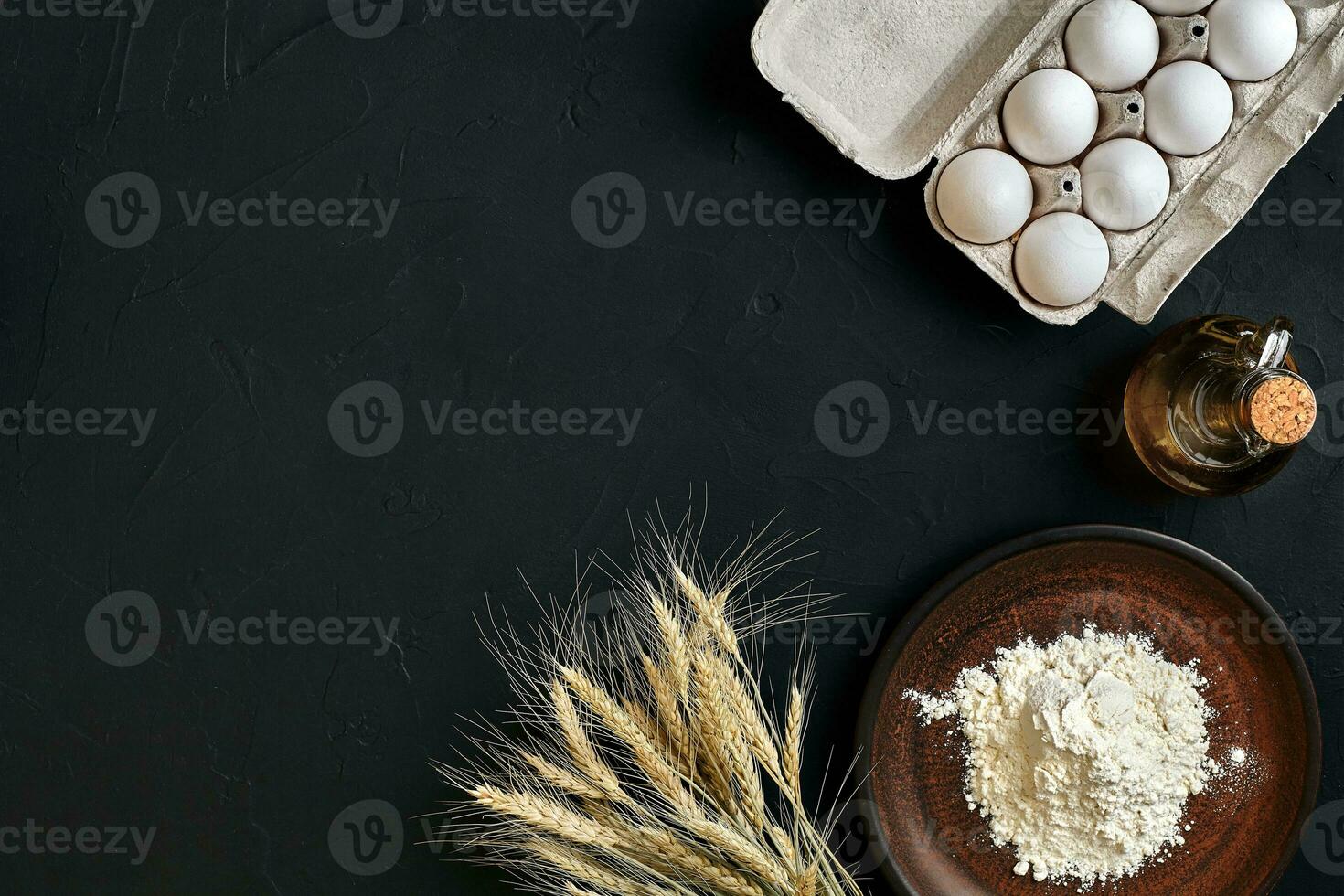 Preparation cooking baking kitchen table brown dishes ware fresh grocery different ingredients eggs, flour, oil, stuff top view photo