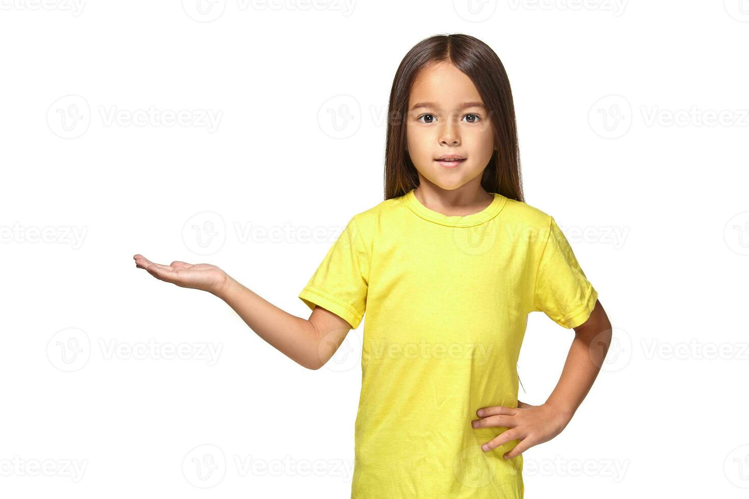 Little girl in yellow t-shirt holding her hand out photo