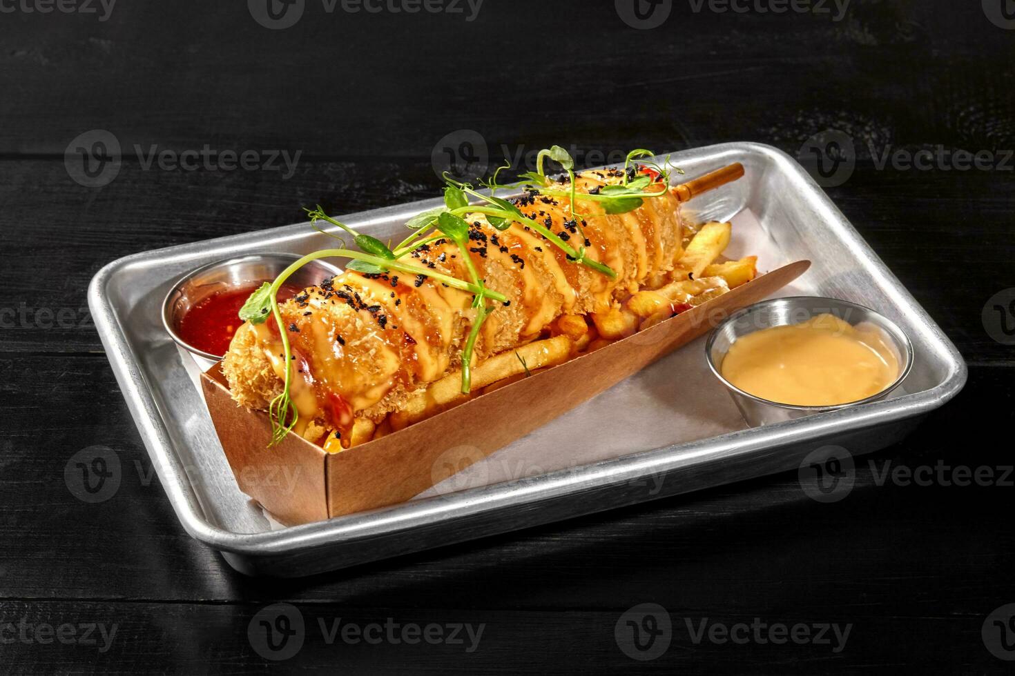 Classic sausage corn dog with french fries, sweet chili and cheddar sauces photo