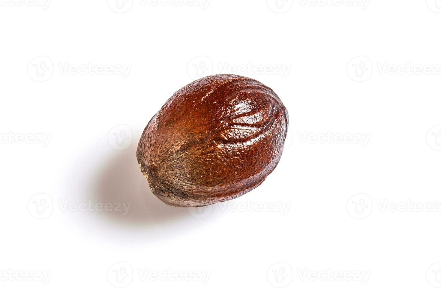Nutmeg spice on a white background photo