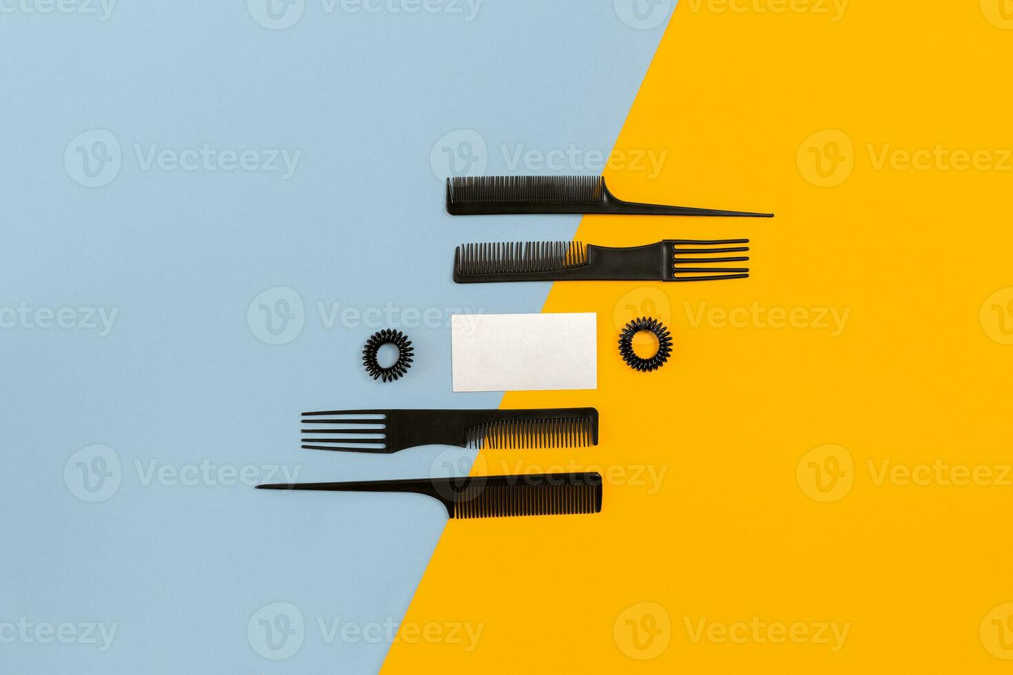 Hairdresser set with various accessories on orange and blue background photo