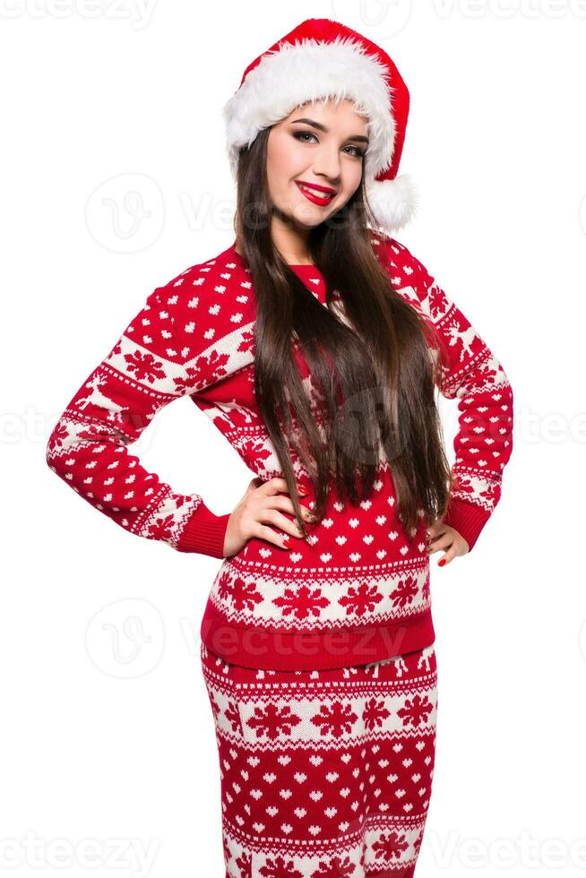 Portrait of a smiling beautiful happy girl in christmas santa hat. Isolated on white background. photo