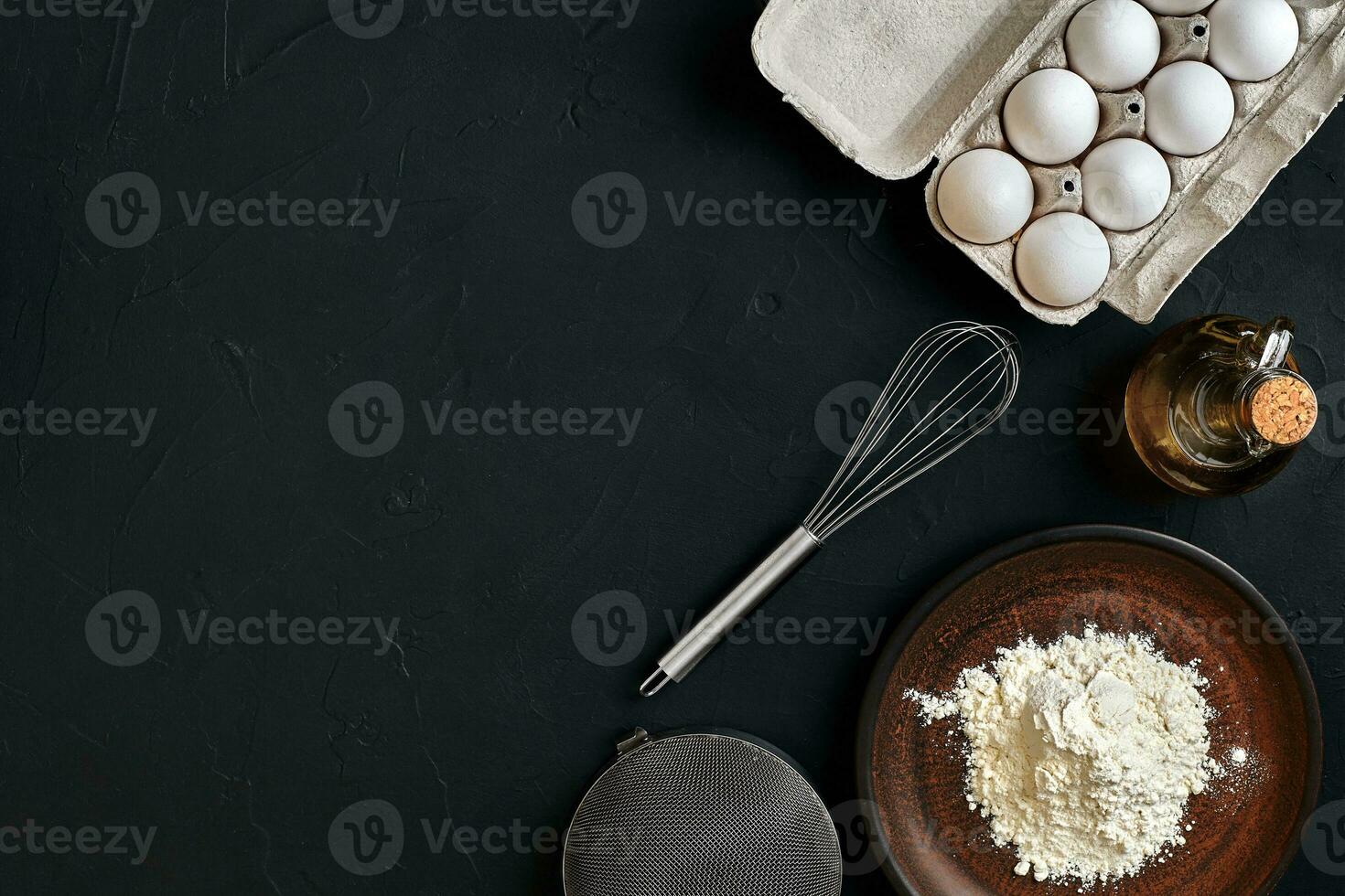 Preparation cooking baking kitchen table brown dishes ware fresh grocery different ingredients eggs, flour, oil, stuff top view photo